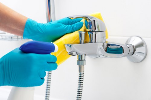 Office cleaning team sanitising shared work areas in Crystal Palace