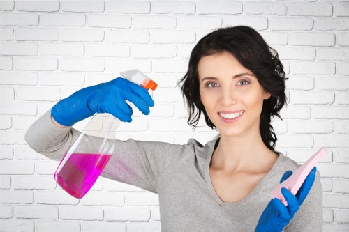 Professional cleaner completing a final safety-focused clean in a property